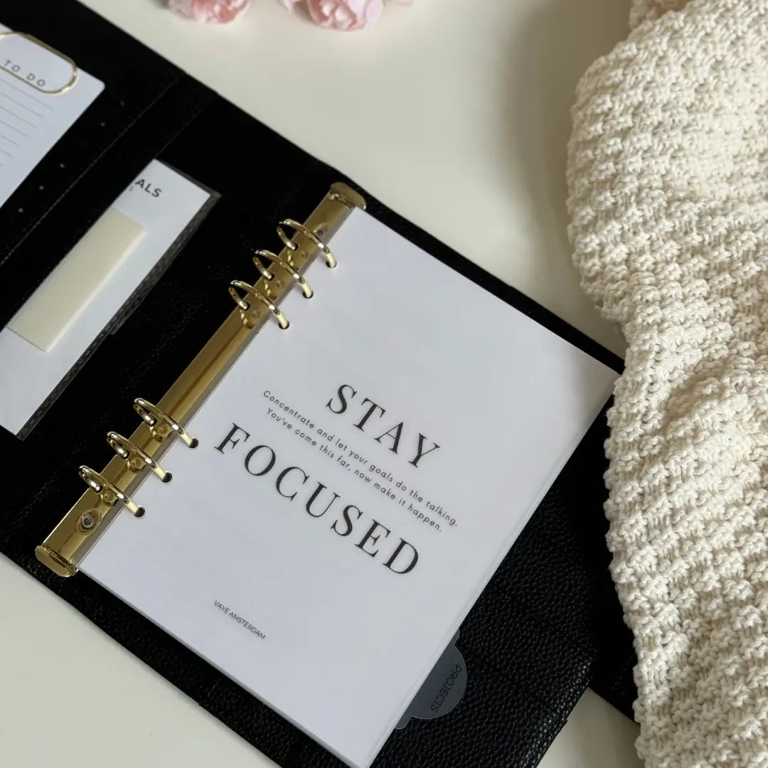 Planner dashboard in A5 van vellum met de tekst stay focused en een korte motiverende tekst.